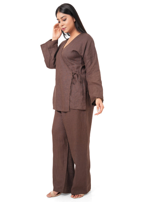 Woman wearing a chocolate brown linen co-ord set on a white background