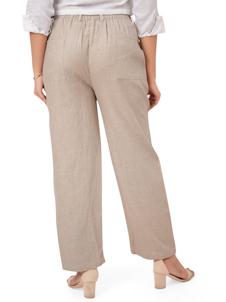 Beige linen pants worn by a person on a white background, back side