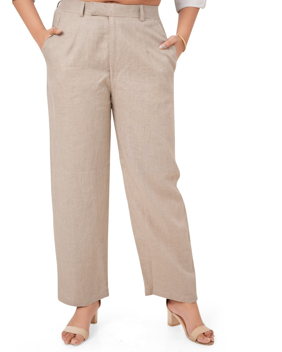 Beige wide-leg linen pants worn by a person on a white background
