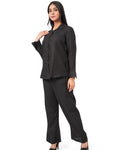Woman wearing a black linen-co-ord-set on a white background